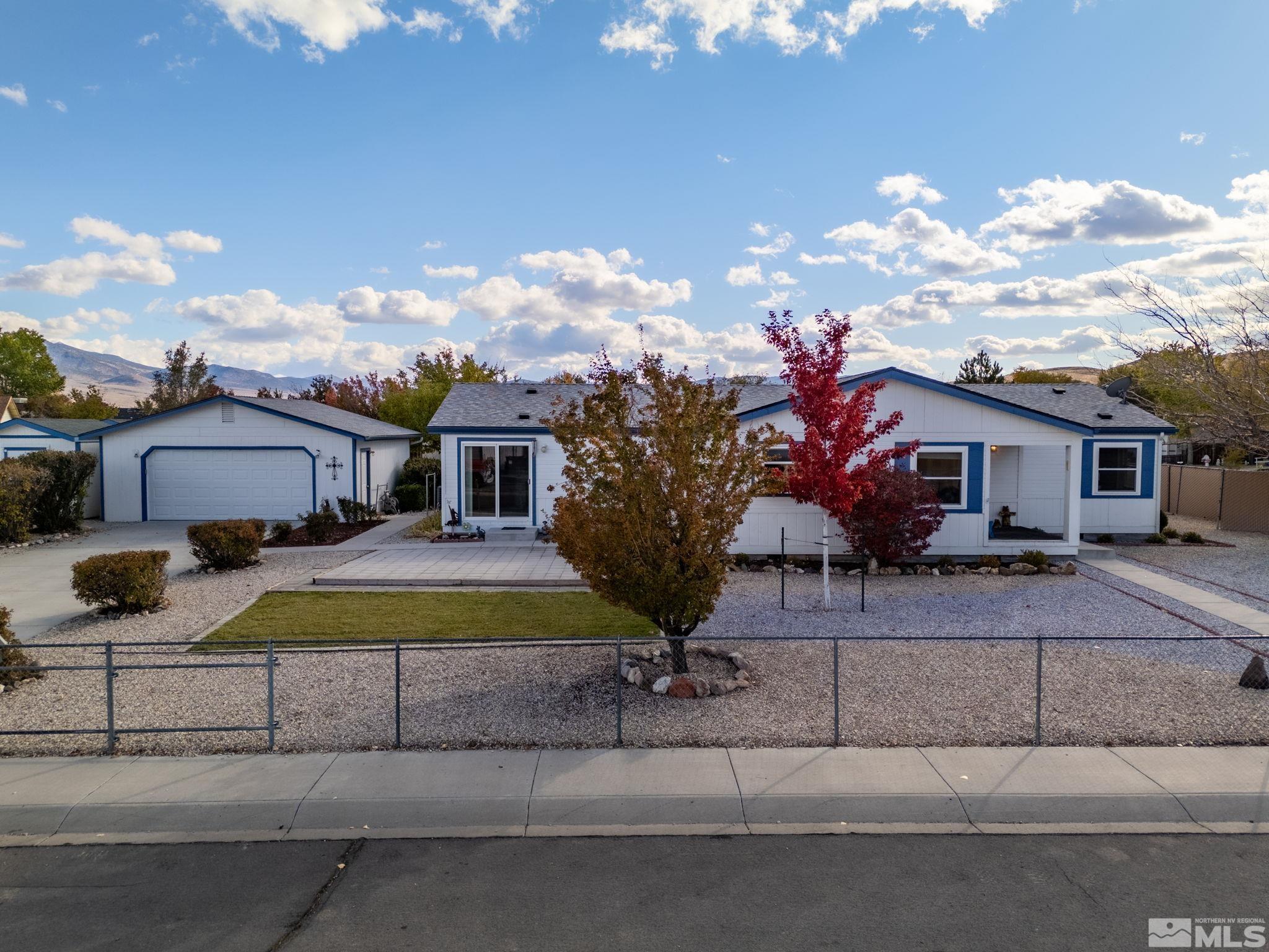 a front view of house with yard and entertaining space