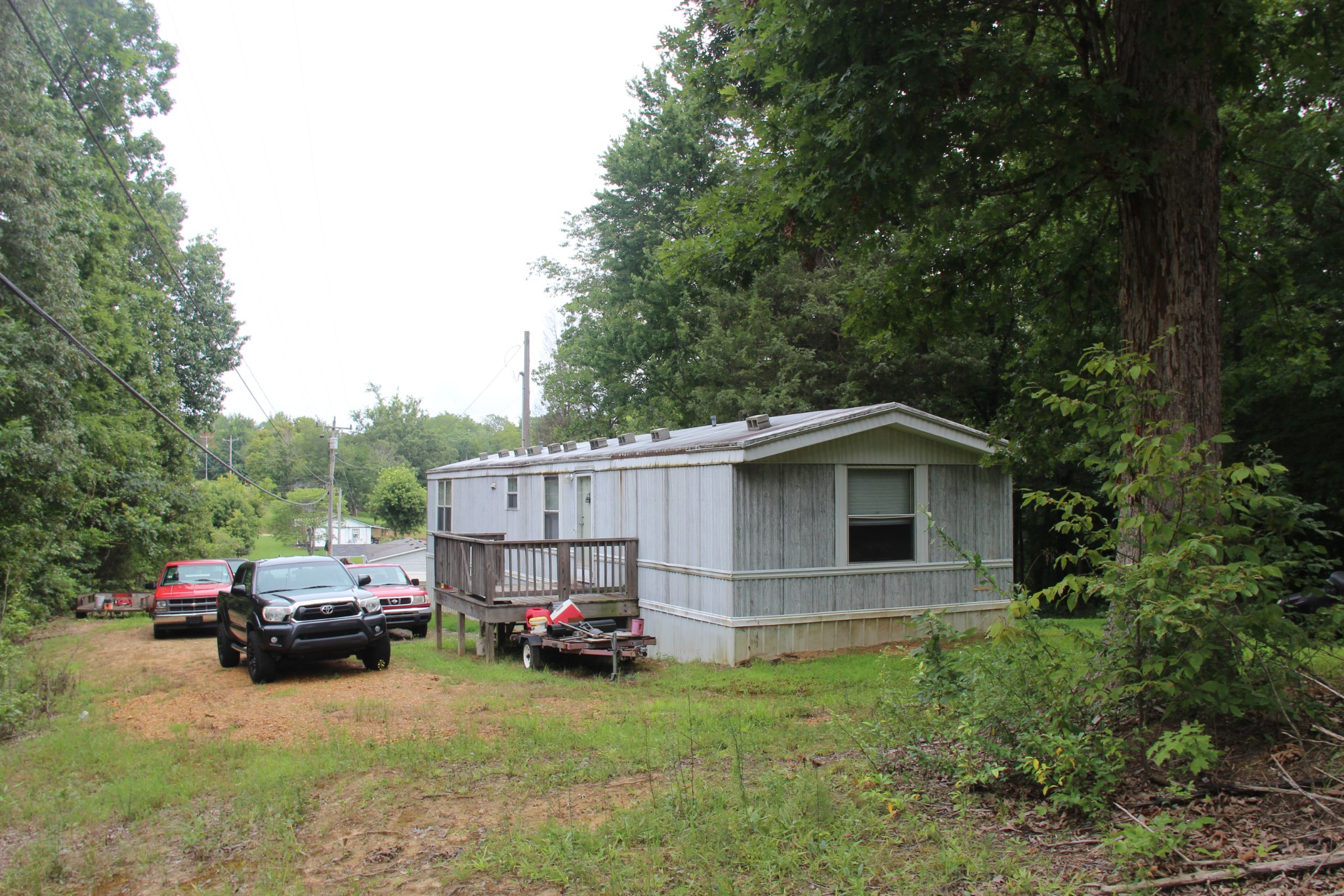 a view of a house with truck parked on the road