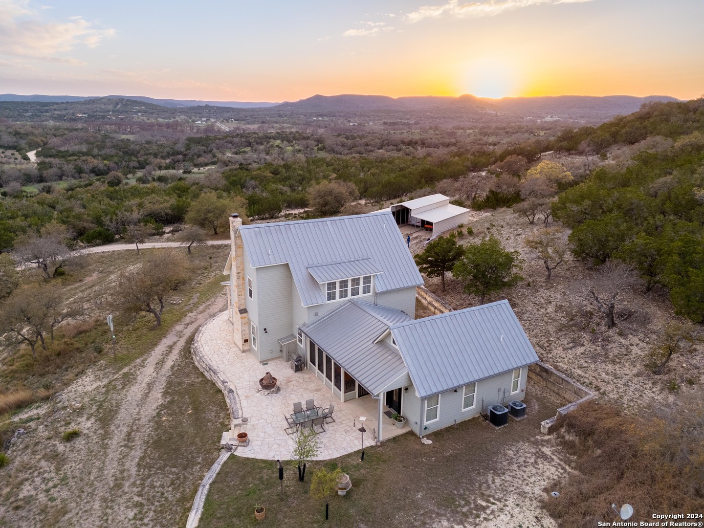 an aerial view of a house with mountain view