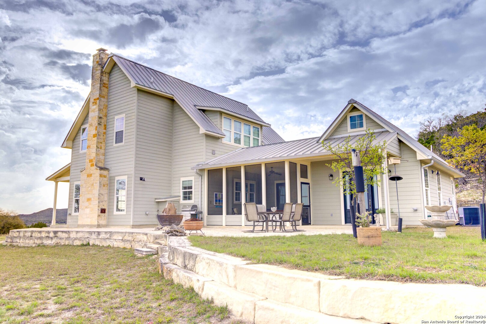 a view of a house with swimming pool and porch