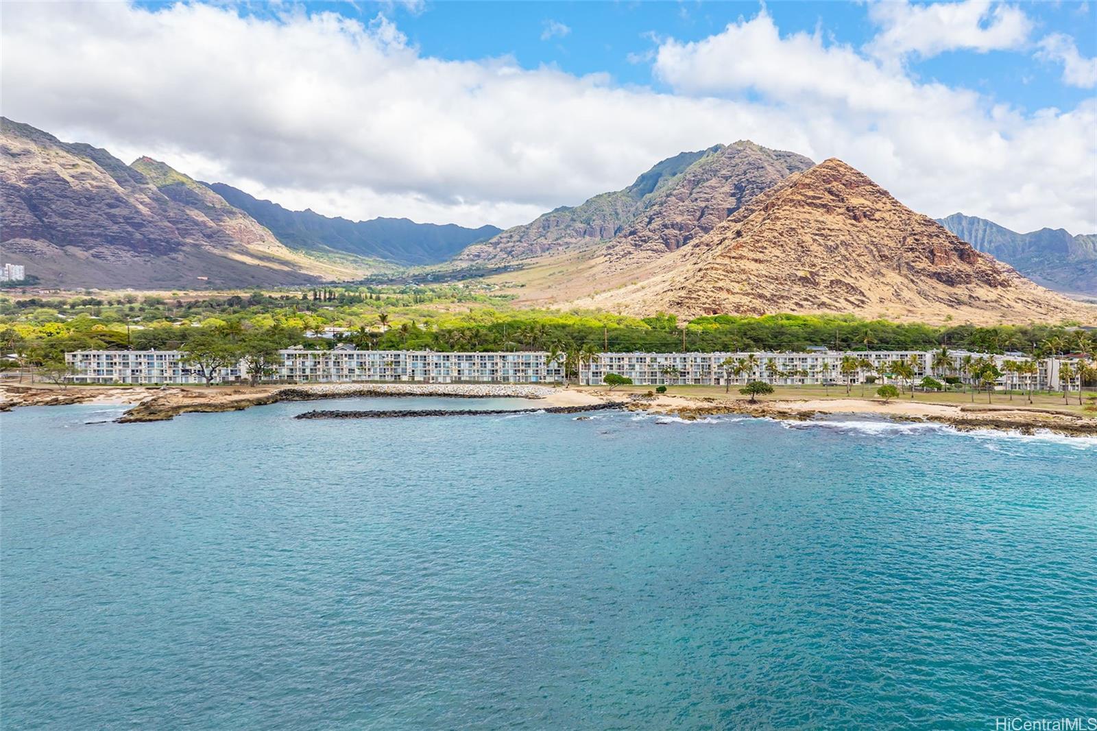 "Breathtaking aerial ocean views of Makaha Surfside and the beach lagoon area."