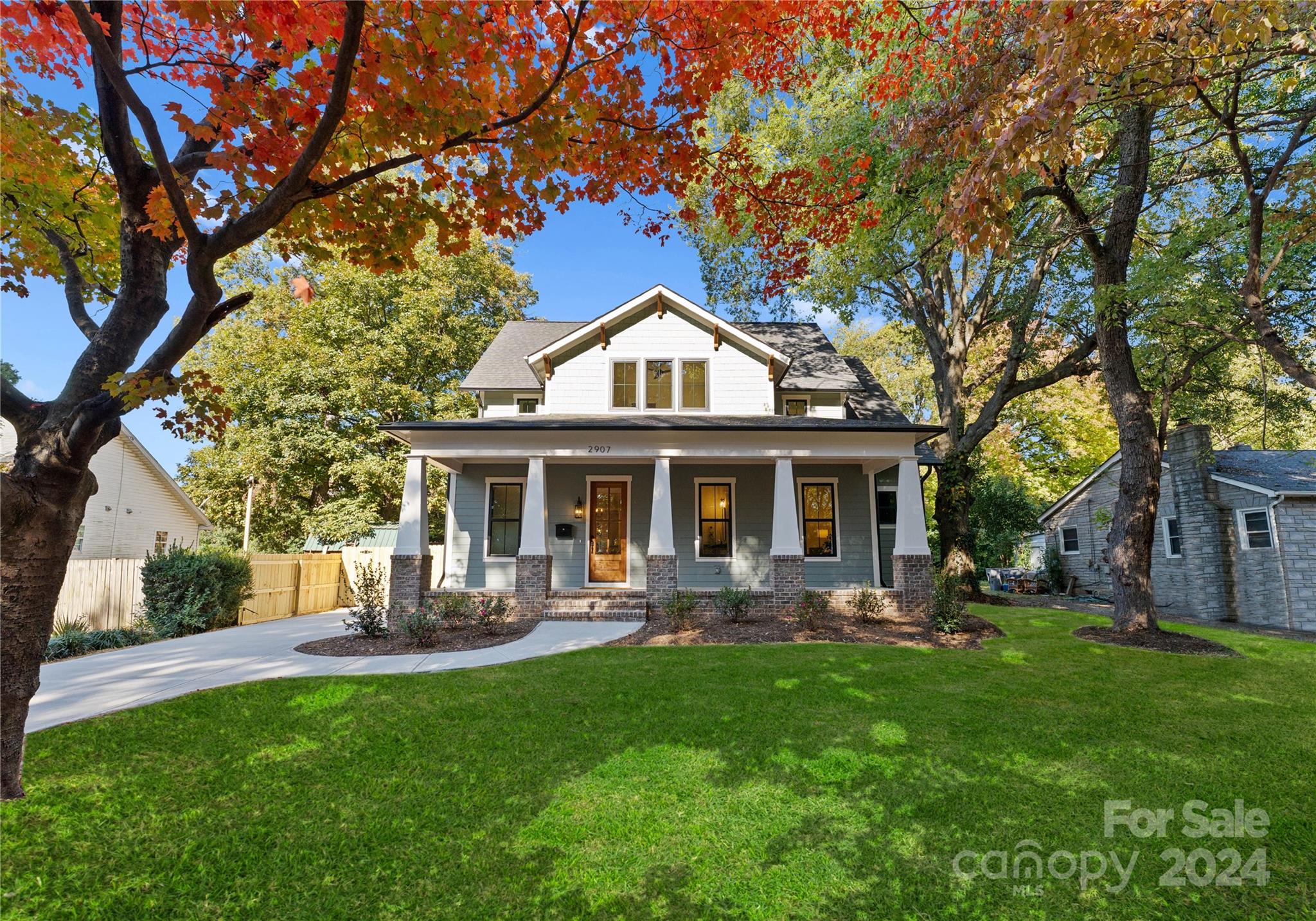 a front view of house with yard and outdoor seating