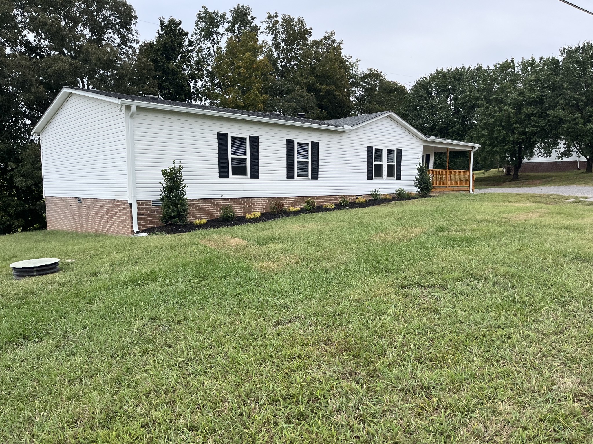 a view of a house with a backyard