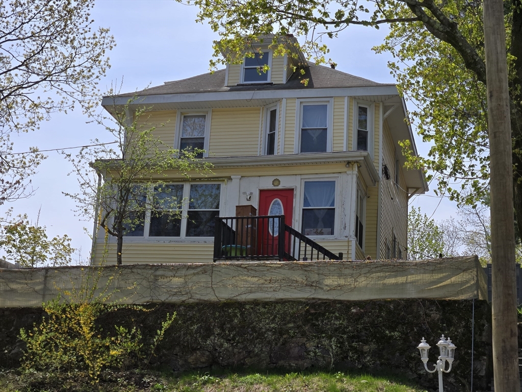 front view of a house with a yard