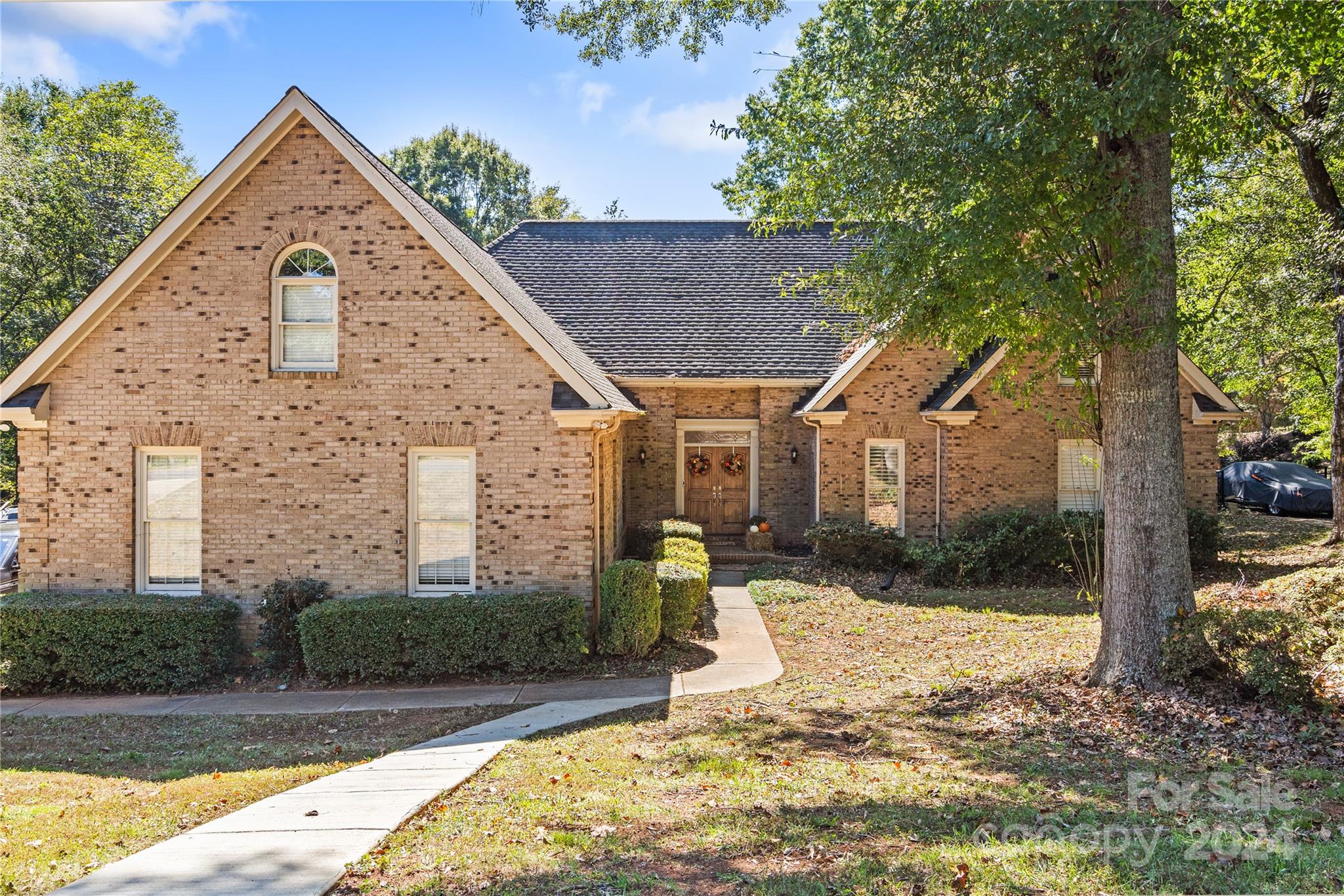 a front view of a house with a yard