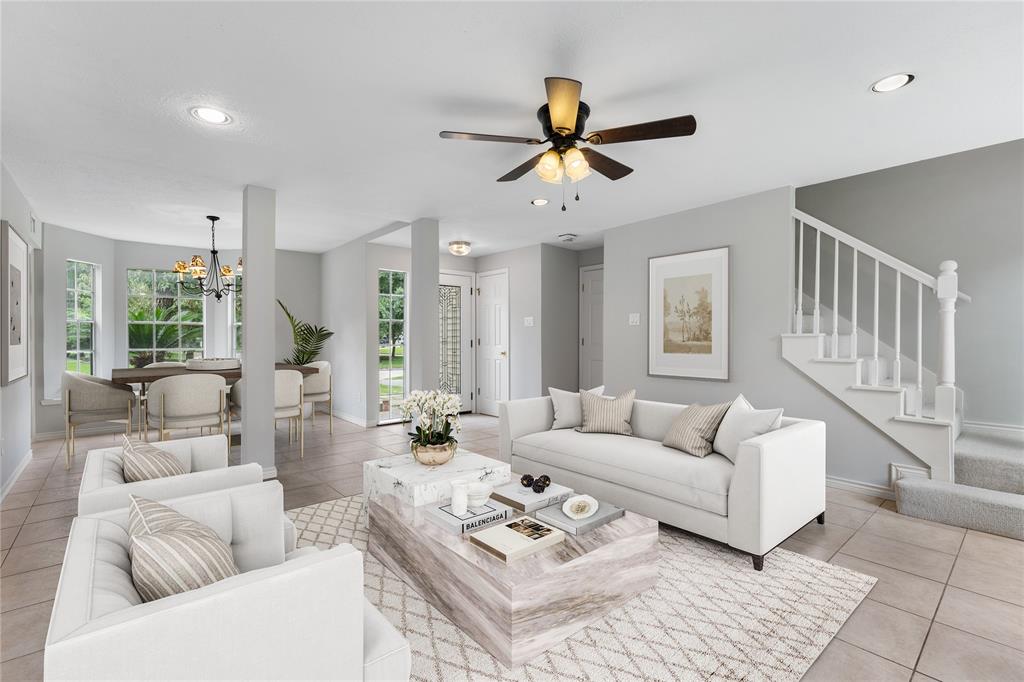 a living room with furniture and a large window