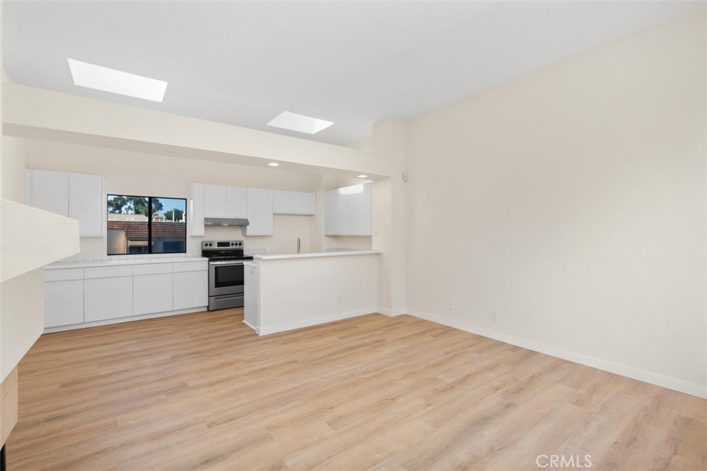 a view of kitchen with wooden floor