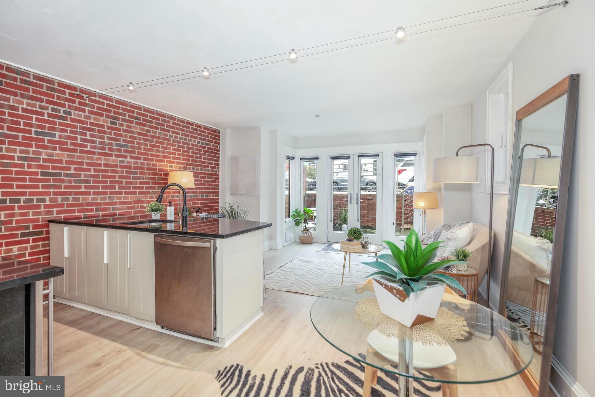 a living room with granite countertop furniture a dining table and chairs