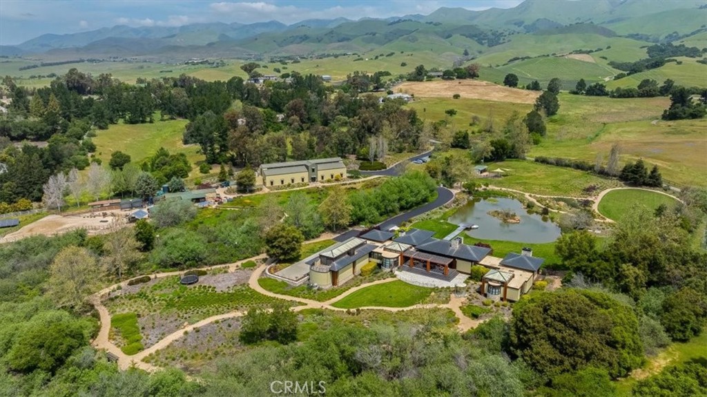 an aerial view of residential house with outdoor space