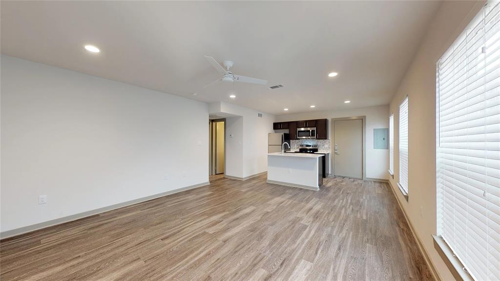 a view of a kitchen with wooden floor