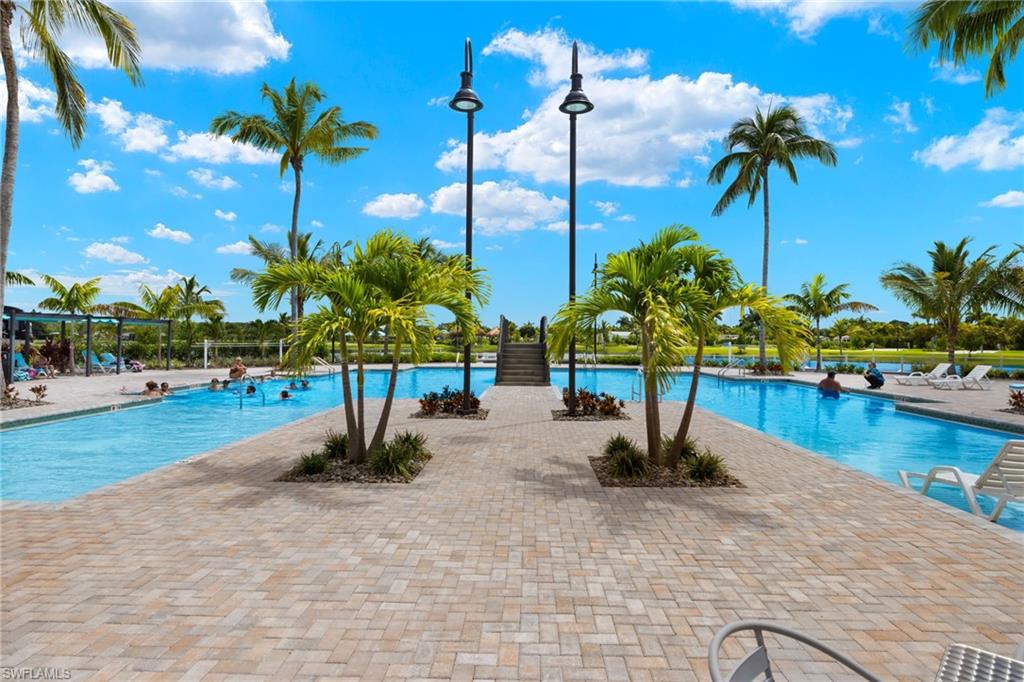 a view of a swimming pool with a yard