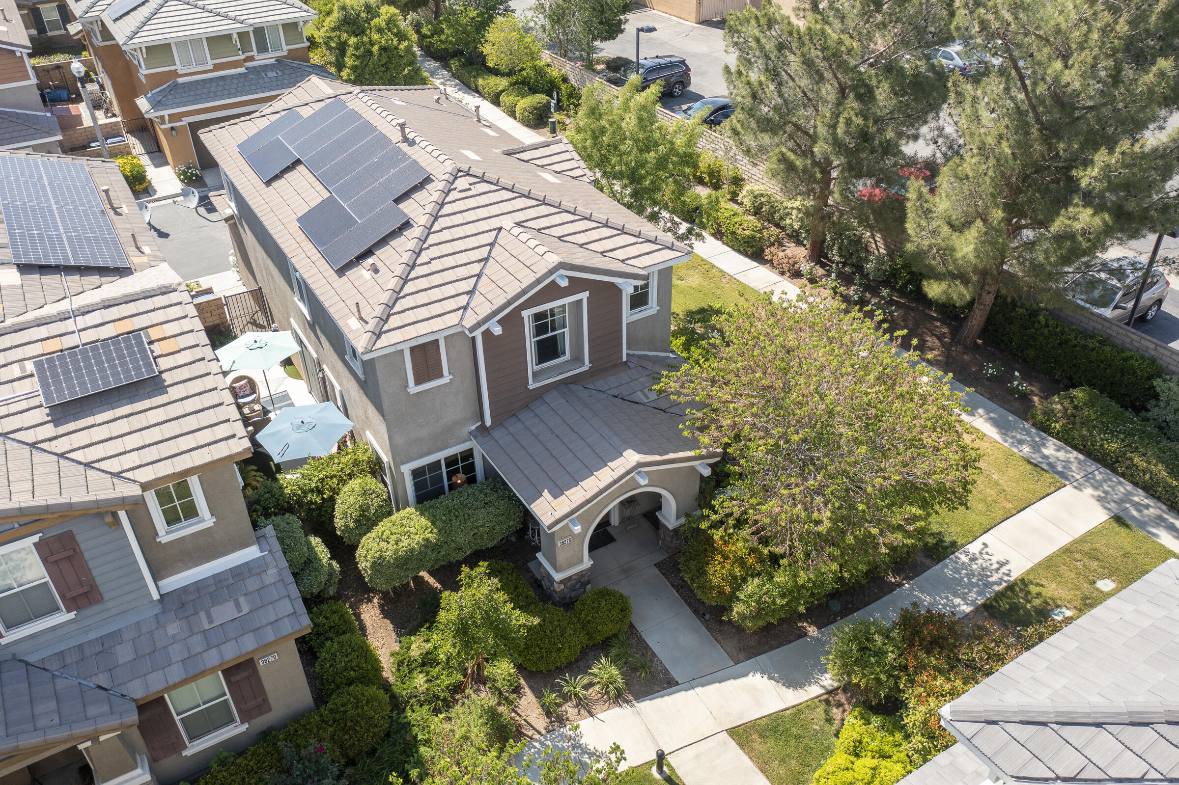 an aerial view of a house with a yard