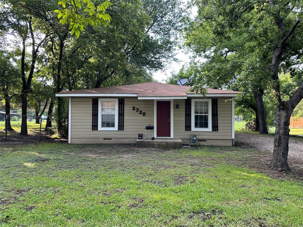 front view of a house with a yard