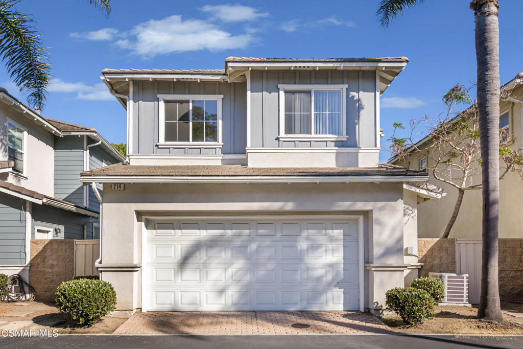 a front view of a house with a garage