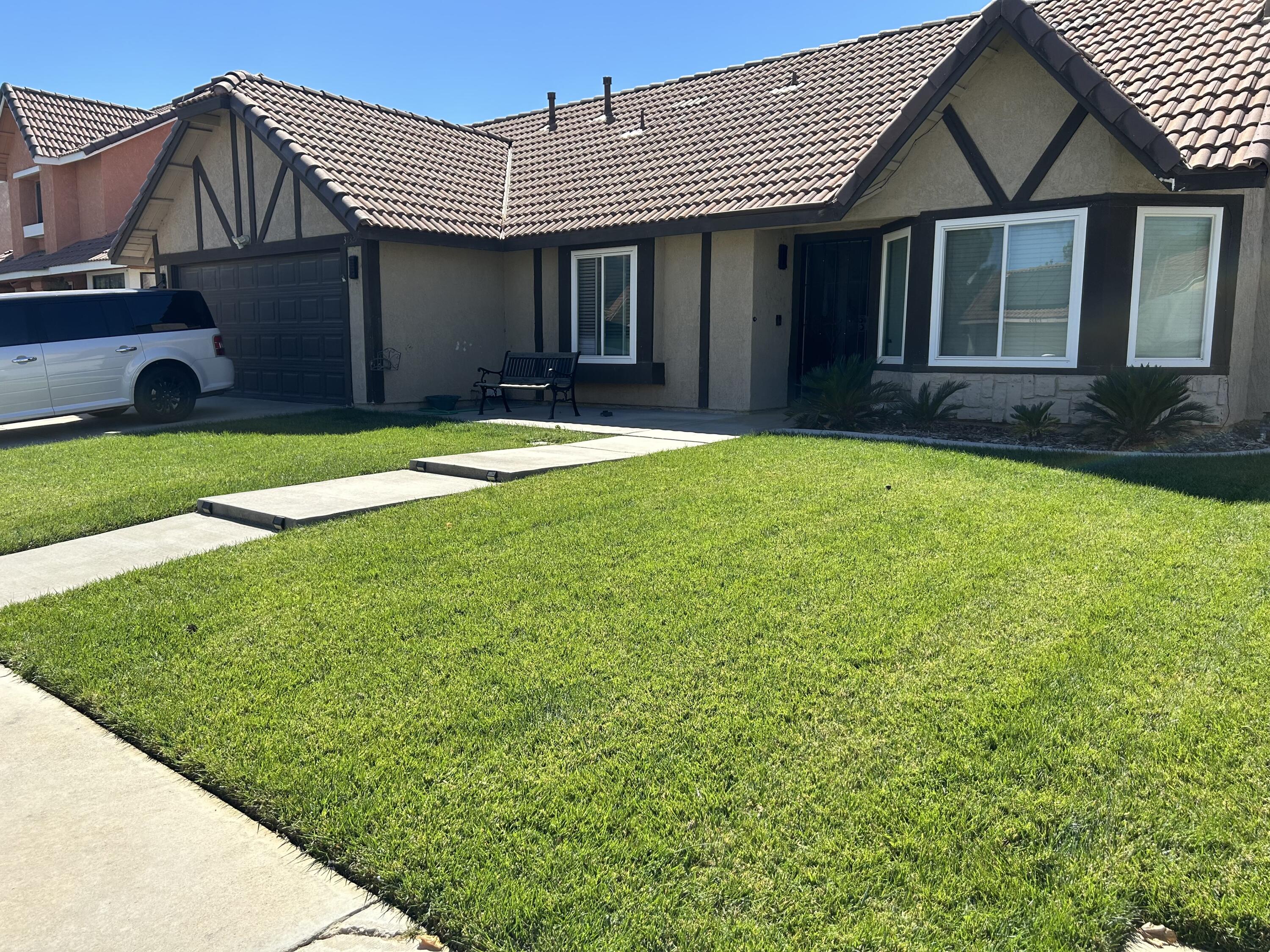 a house with garden in front of it