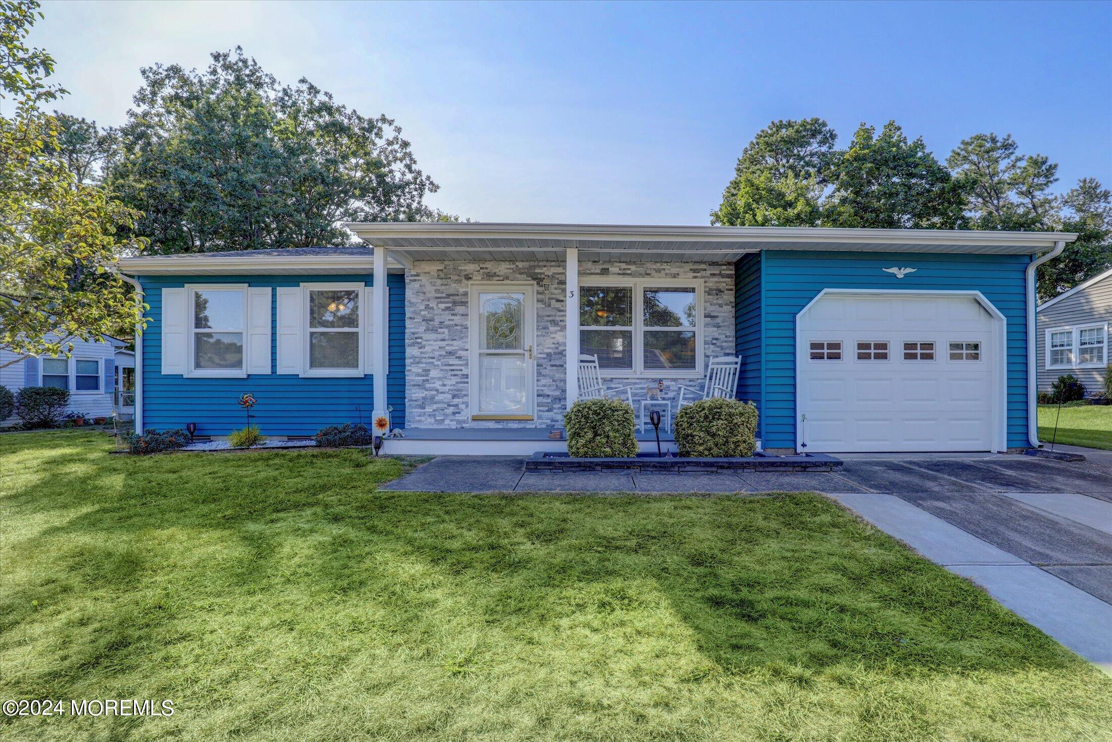 front view of a house with a yard