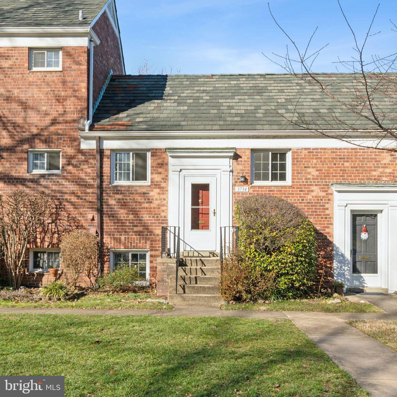 front view of a house with a yard