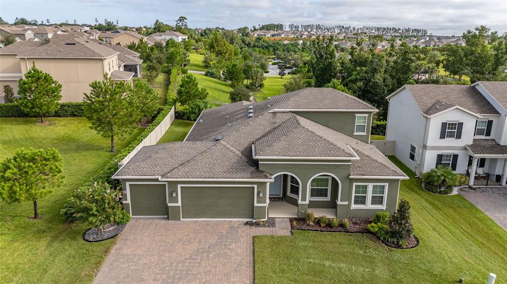 an aerial view of a house with garden