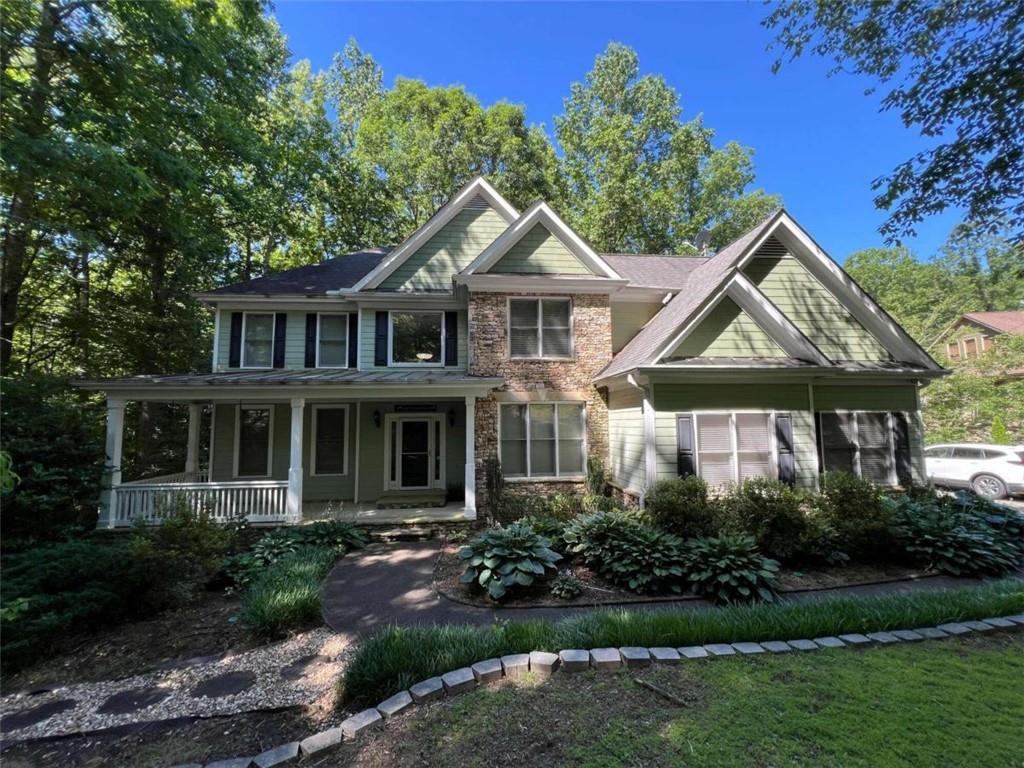 a front view of a house with garden