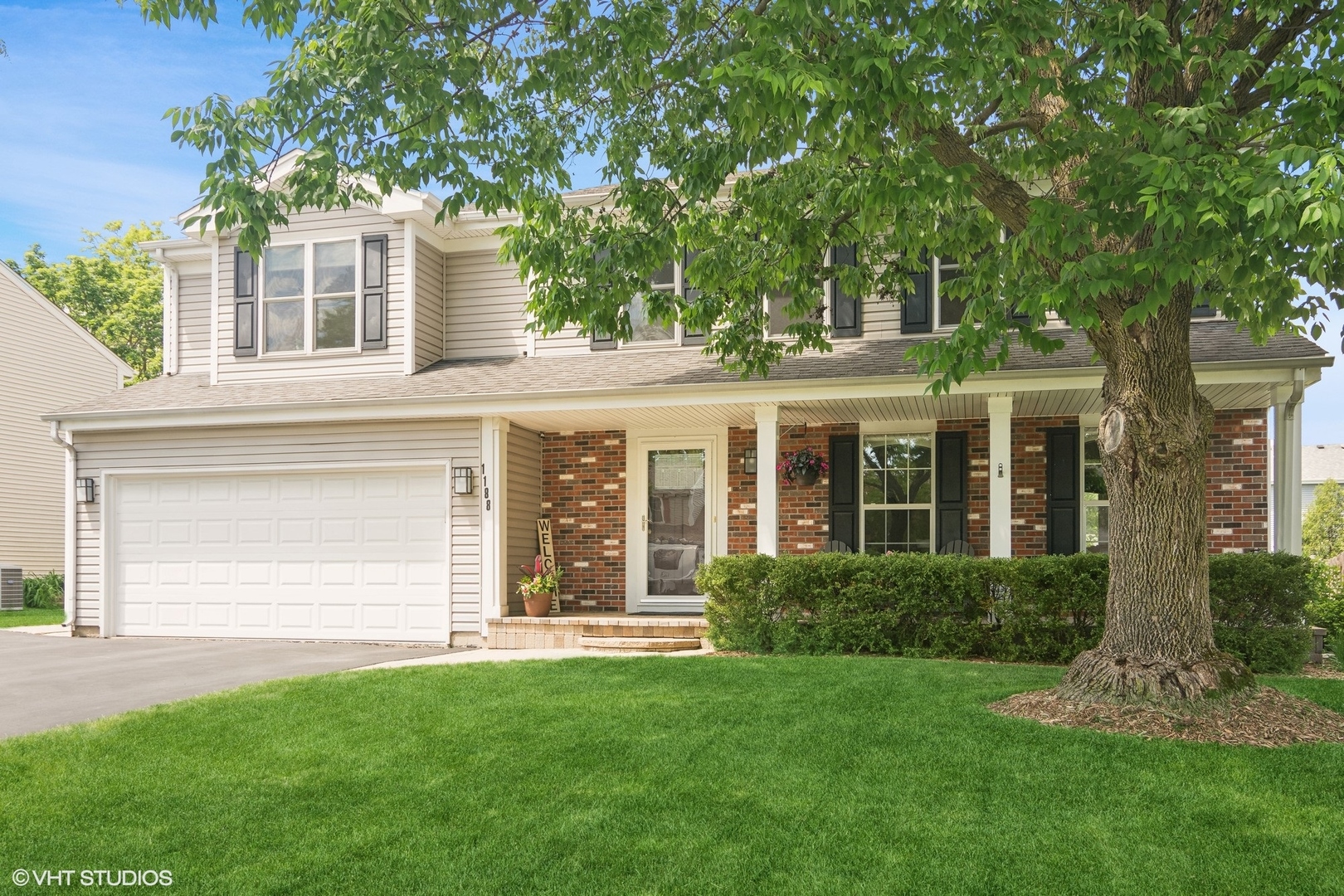 front view of a house with a yard