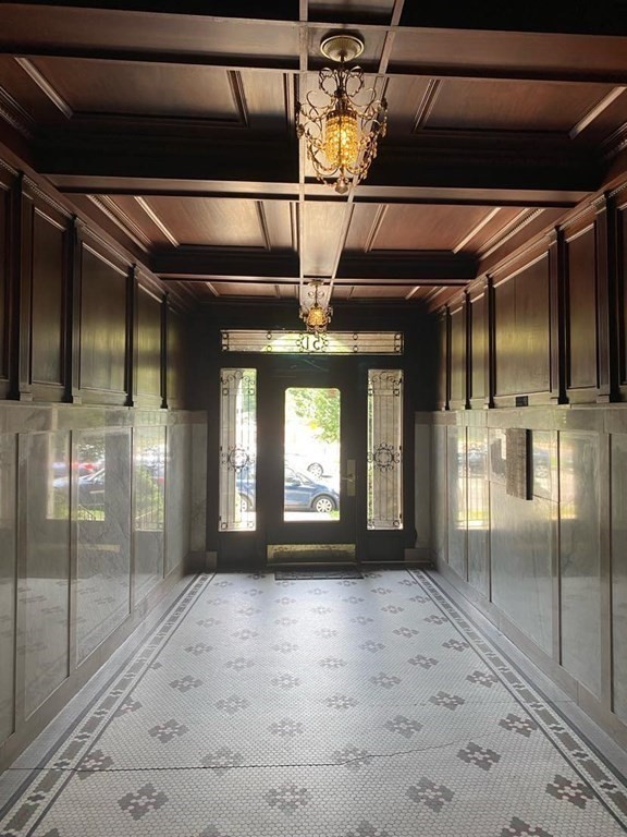 a view of a hallway with a glass door