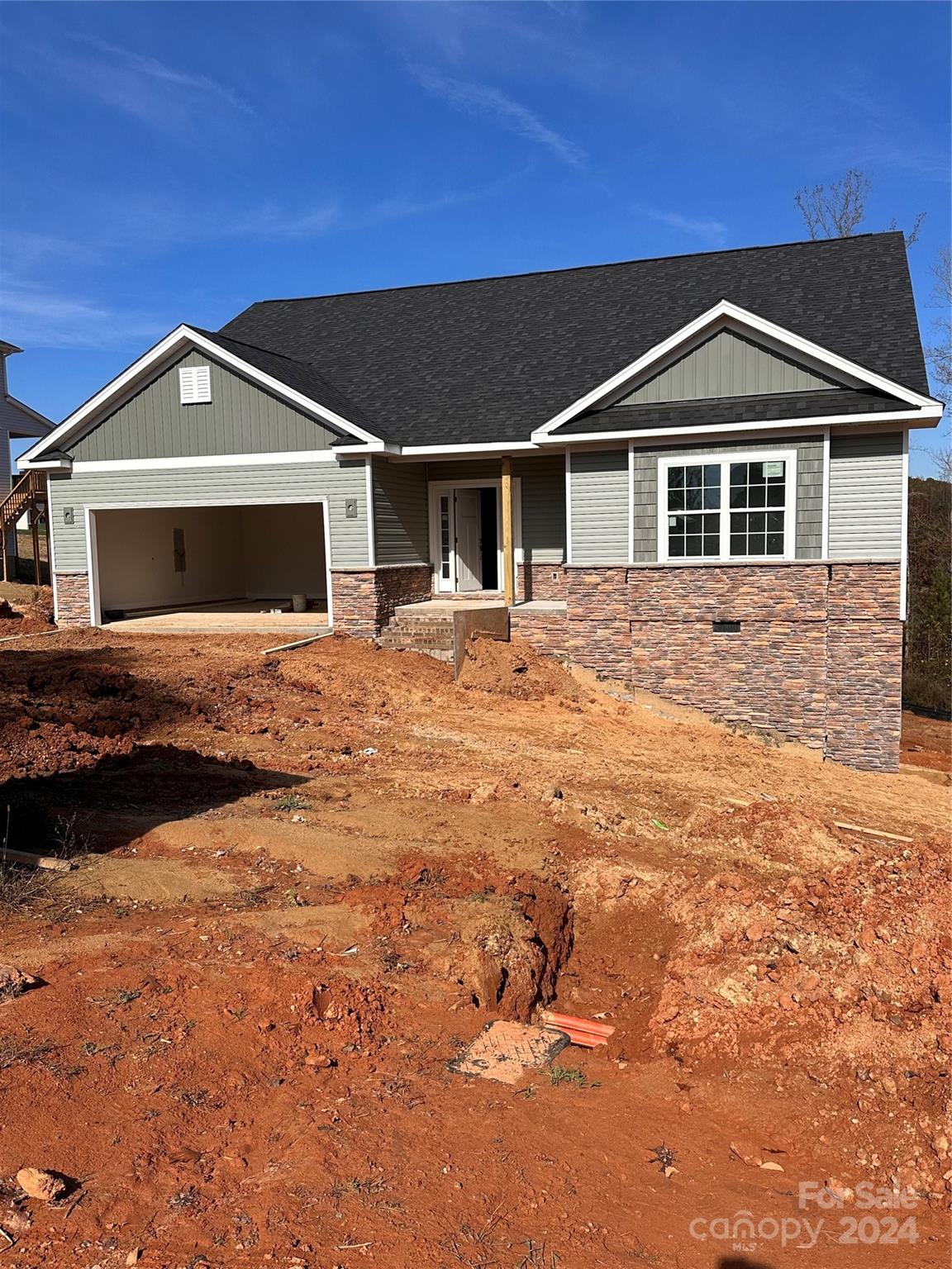 a front view of a house with yard