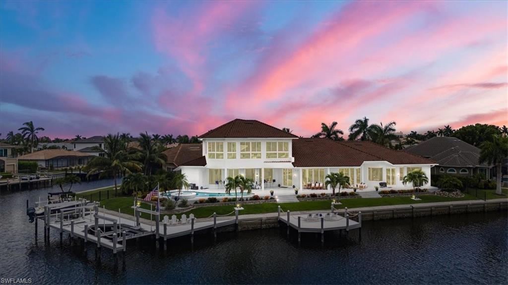 a view of houses with outdoor space and lake view