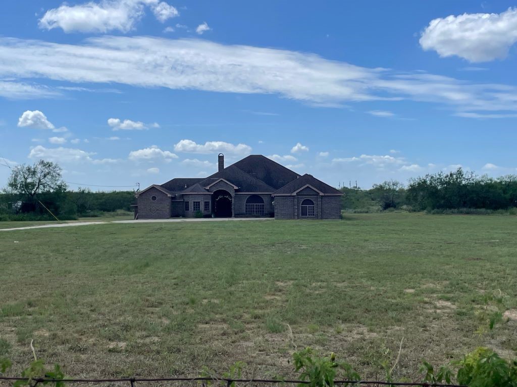 a view of a house with a big yard