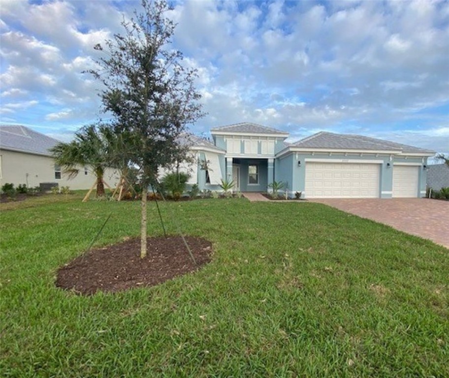 a view of a house with a back yard