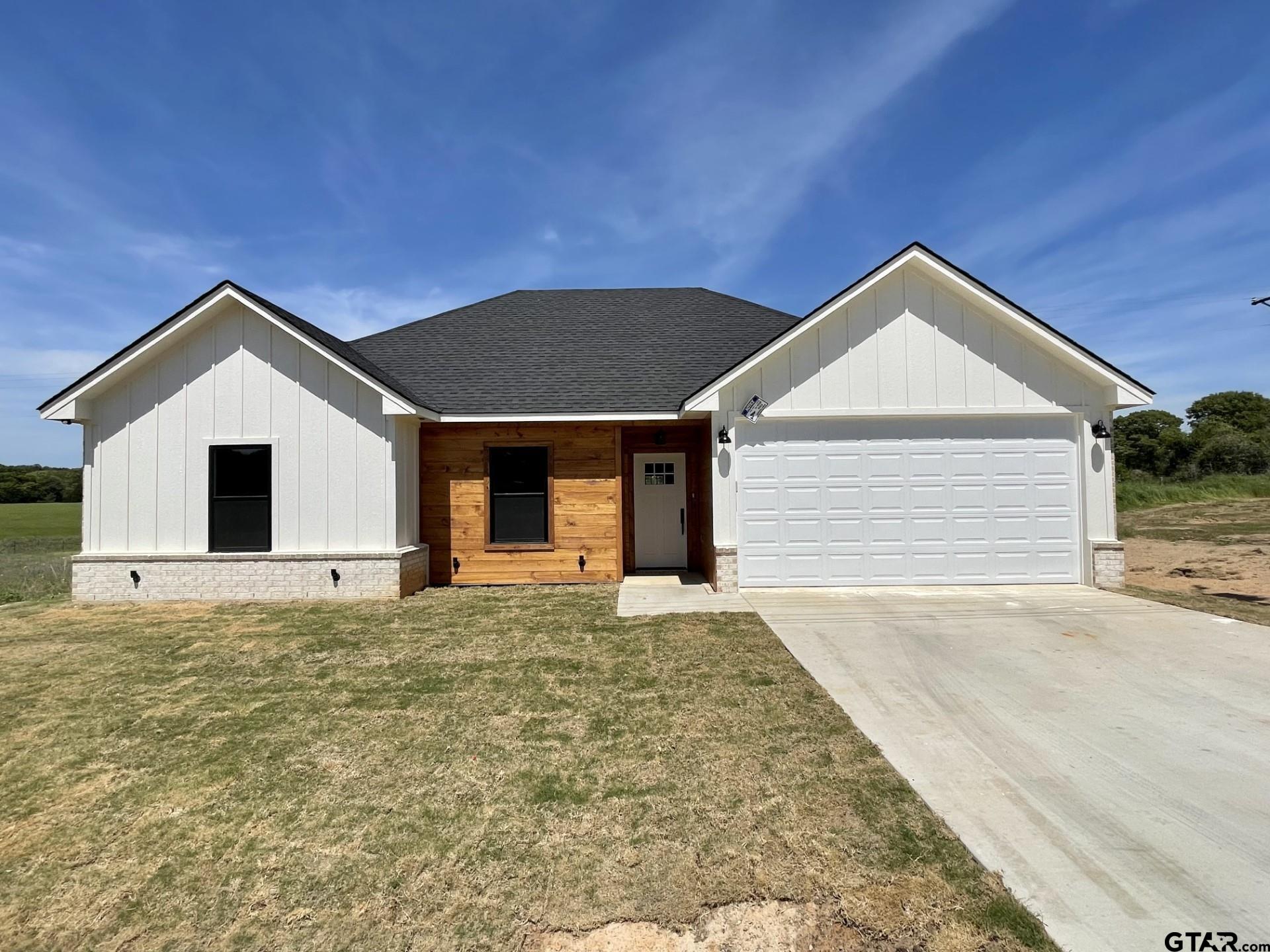 a front view of a house with a garage