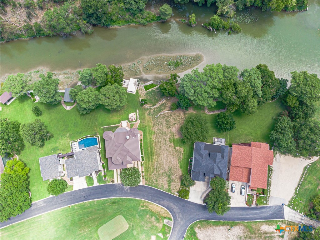 an aerial view of a house with a lake view