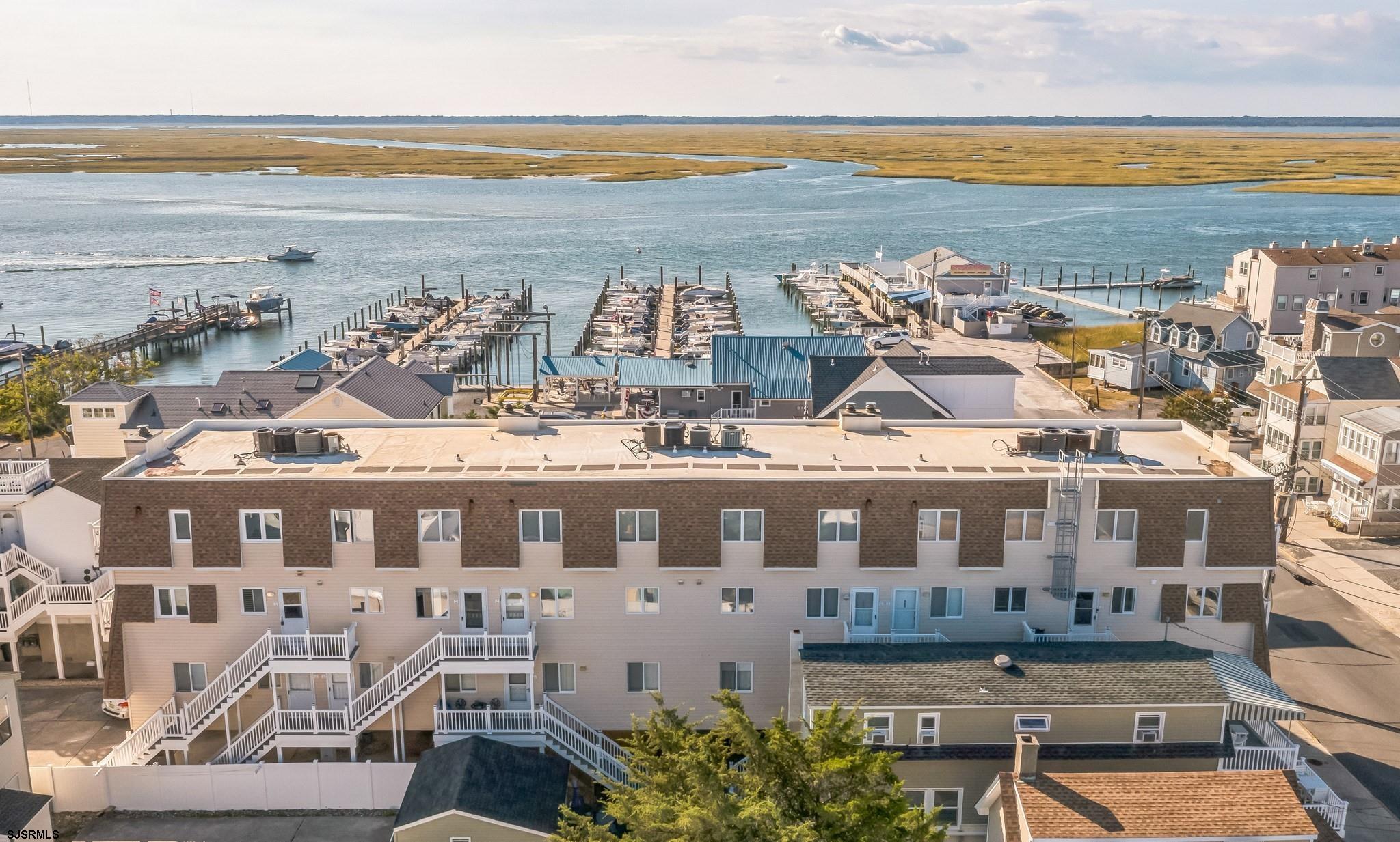 a view of building with outdoor space and ocean view