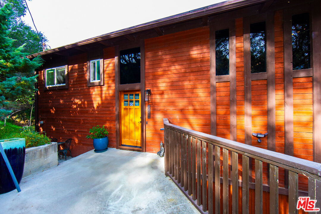 a view of a brick house with a large windows