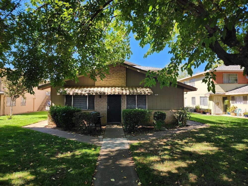 a view of a house with a yard