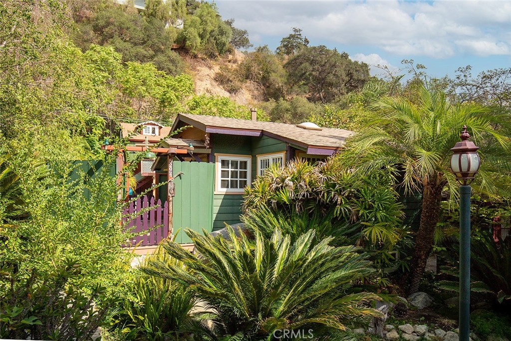 a view of a house with a tree