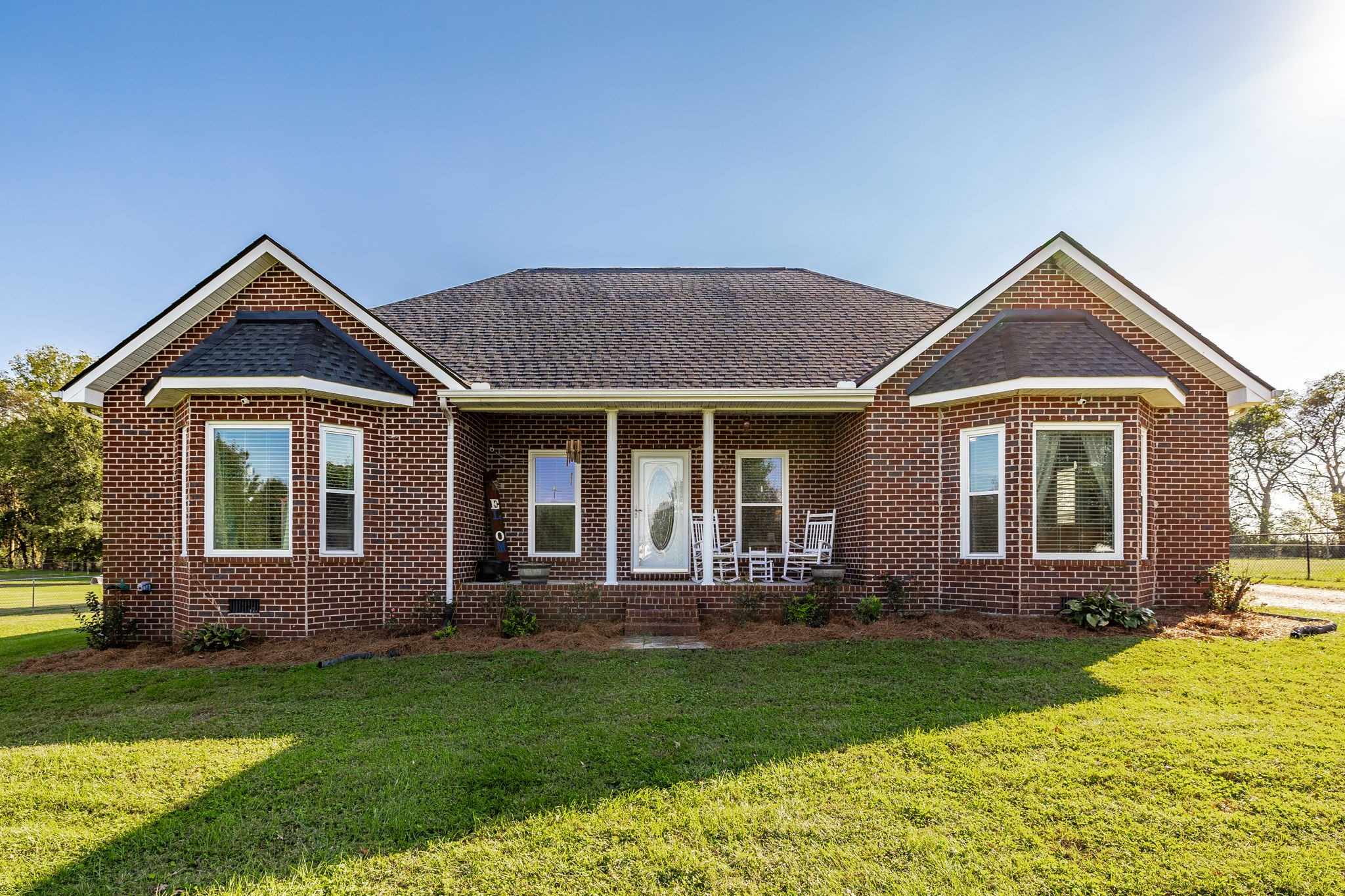 a front view of a house with a yard