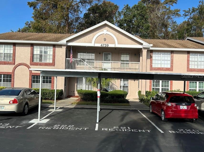 a front view of a house with parking space