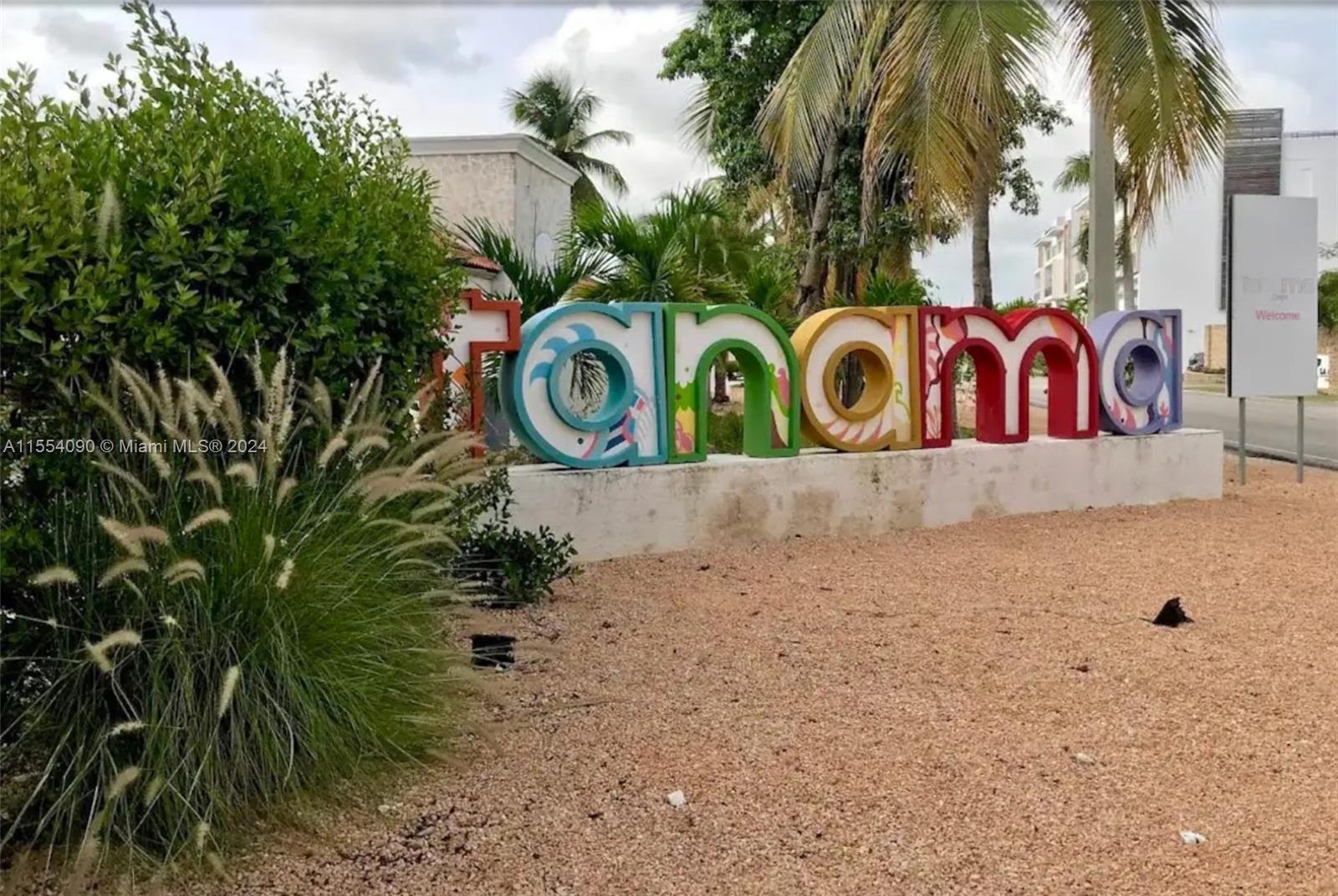 a street sign that is on a sidewalk