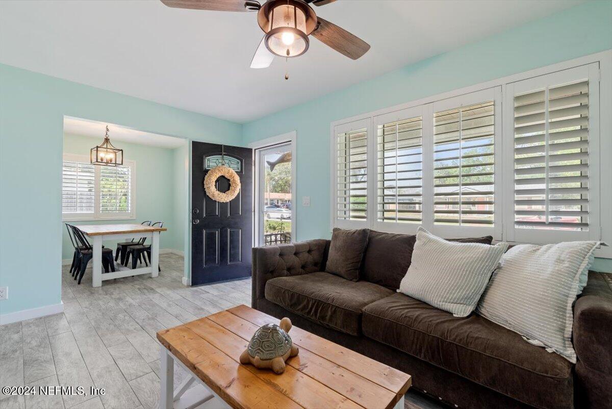 a living room with furniture and a window