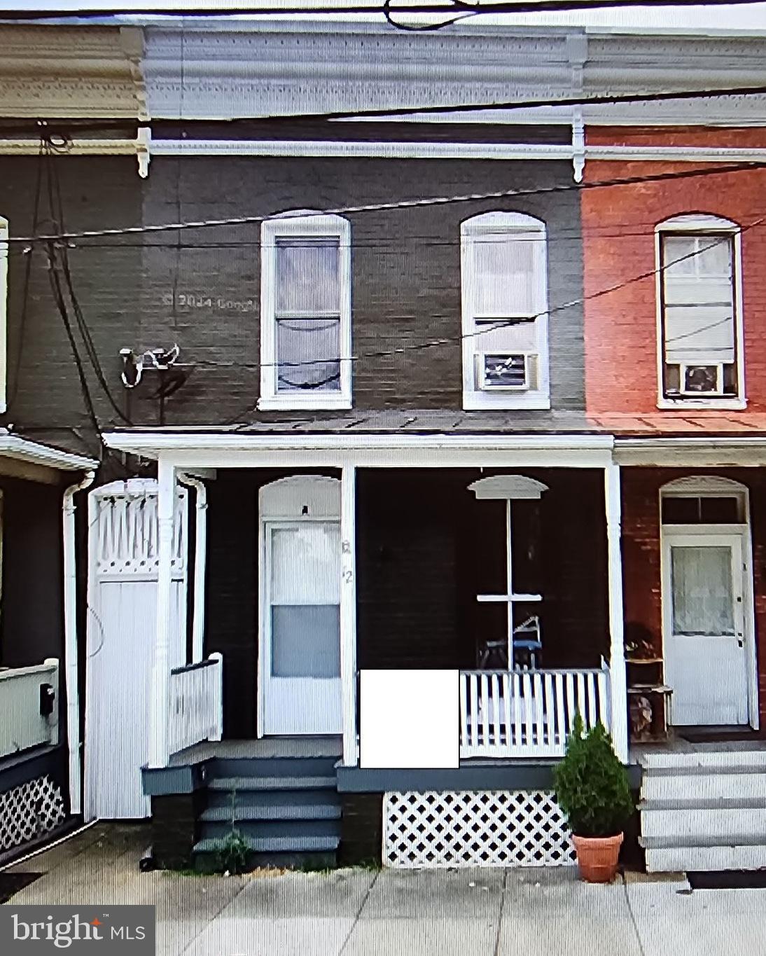 a front view of a house with a door