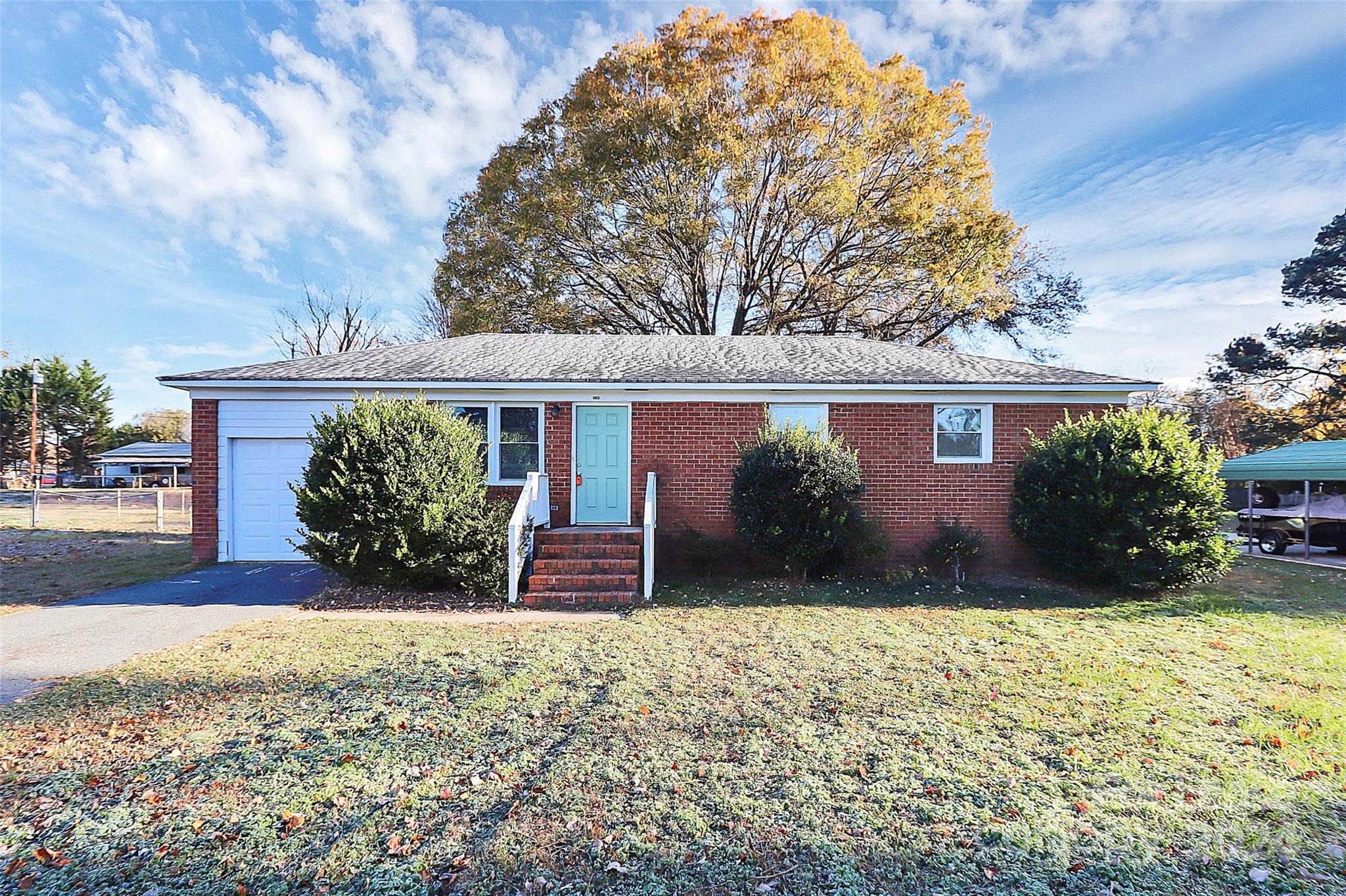 front view of a house with a yard