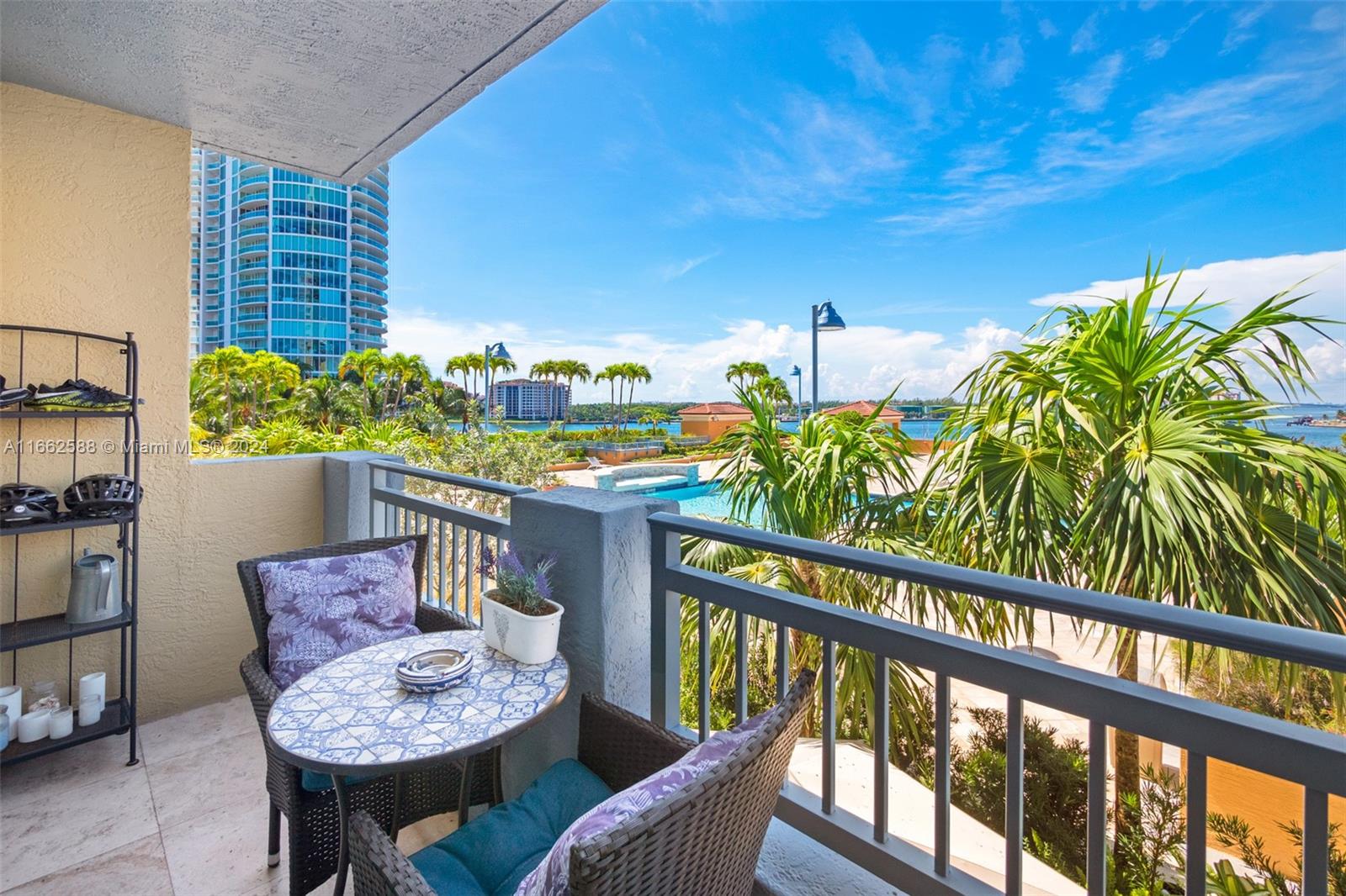 a balcony with furniture and a potted plant