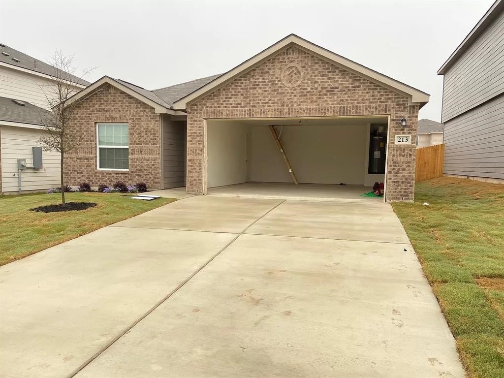 a view of garage and yard