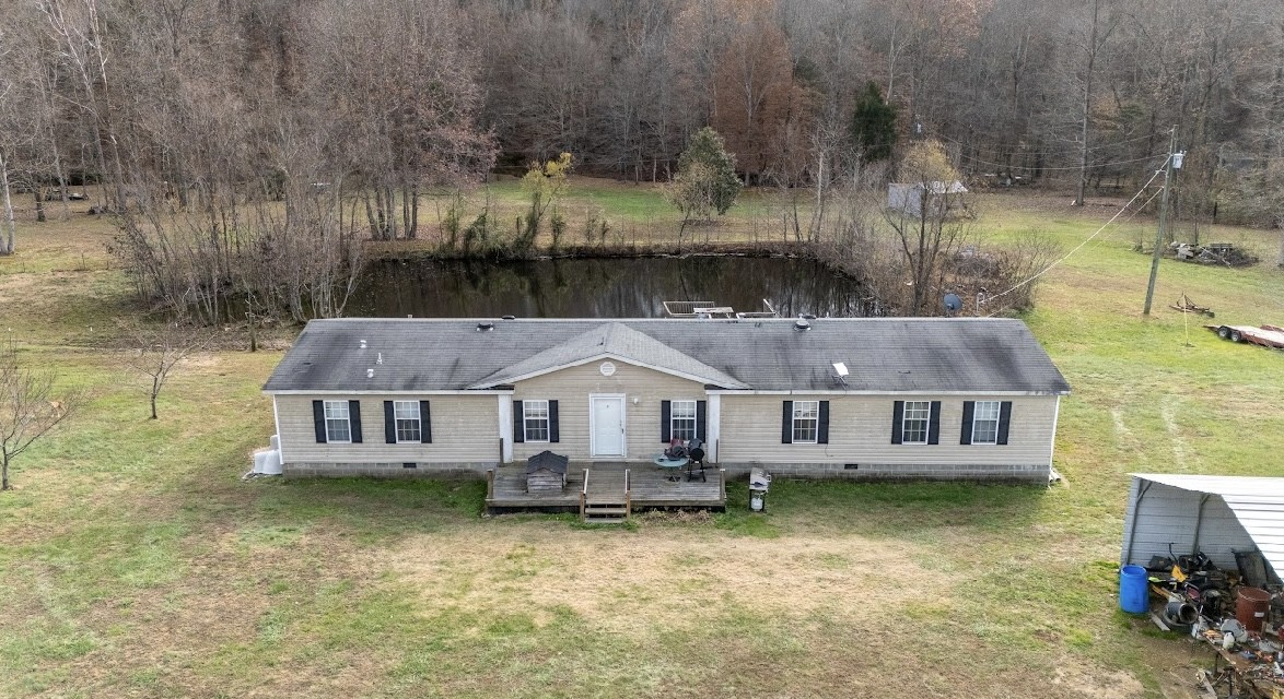 a aerial view of a house with a yard