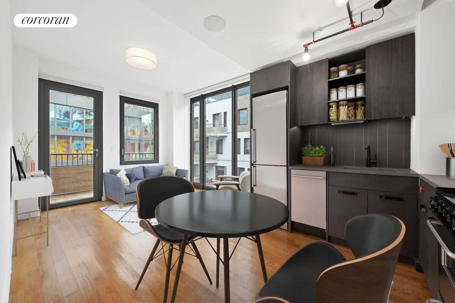 a dining room with furniture and wooden floor