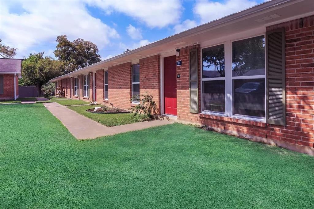 a front view of house with yard and outdoor seating