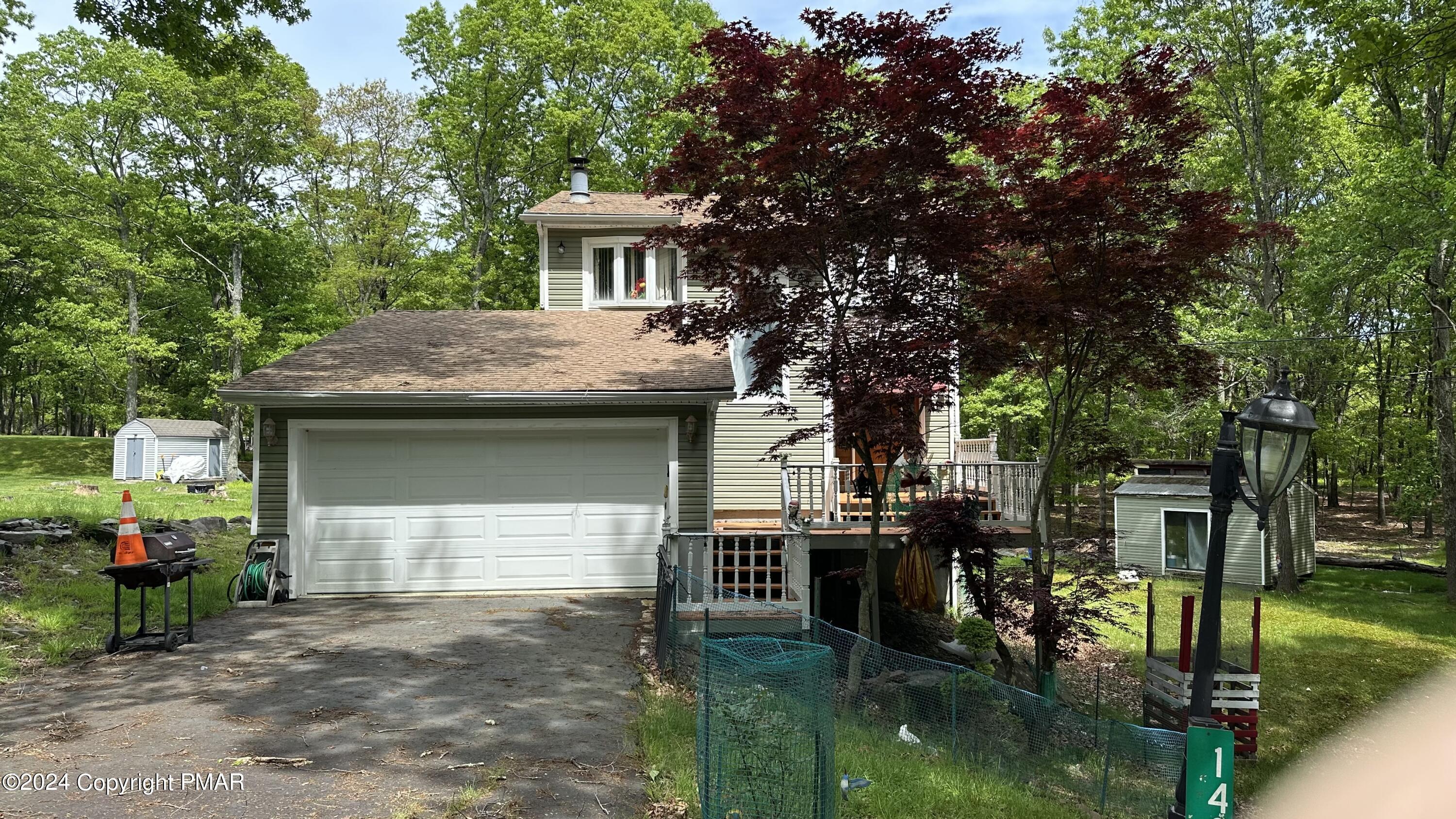 a house view with a garden space