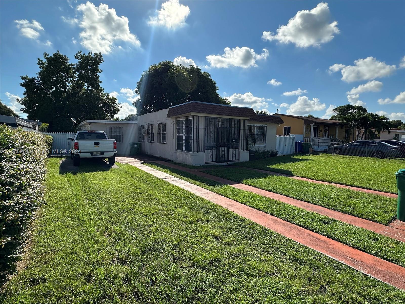 a view of a house with a big yard