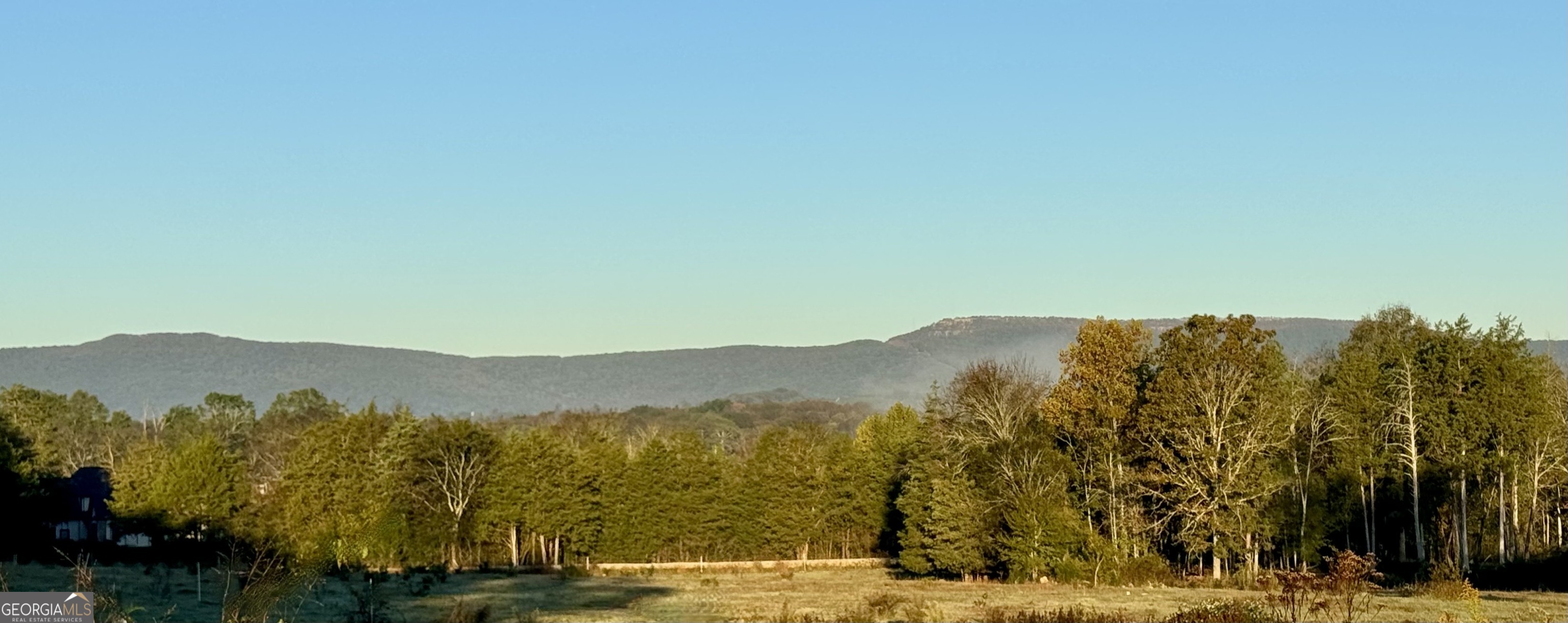 a view of mountain view with mountains in the background