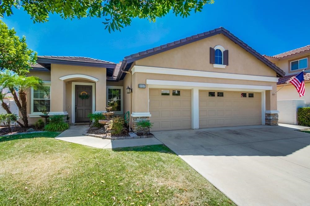 a front view of a house with porch and outdoor seating